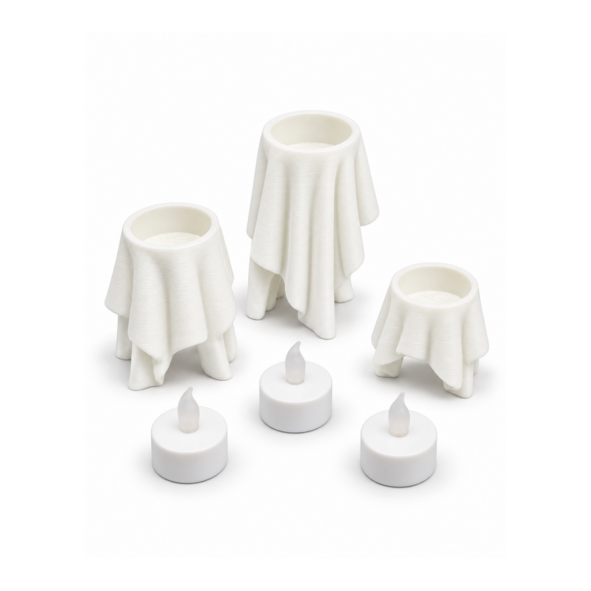 Floating Drape tealight holders in three sizes shown with LED tealights