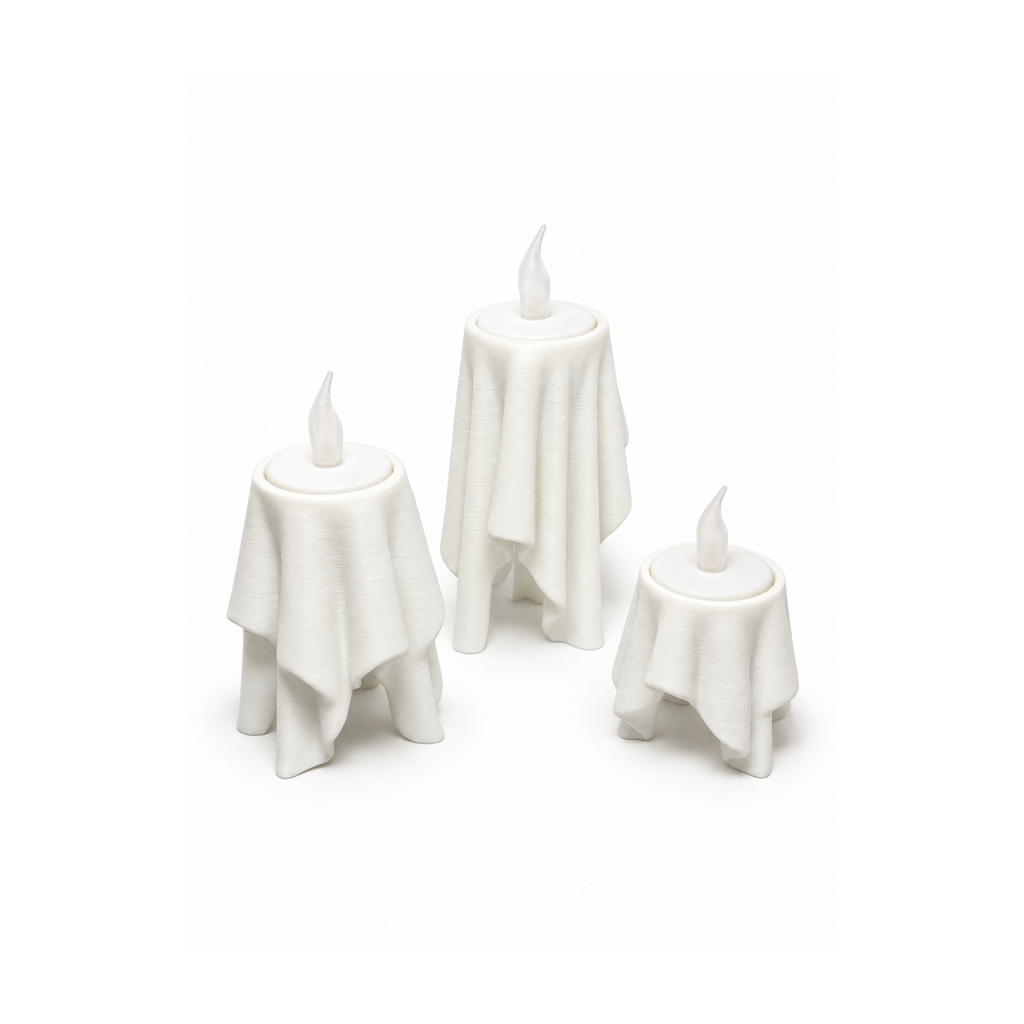 Floating Drape LED tealight holders in three sizes on white background