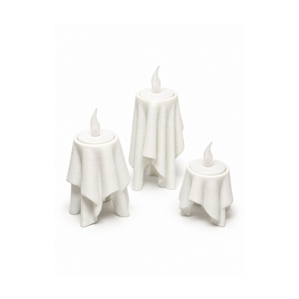Floating Drape LED tealight holders in three sizes on white background